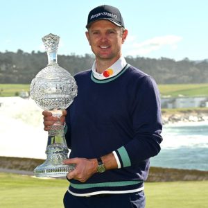 Justin Rose wins Pebble Beach, holds crystal trophy
